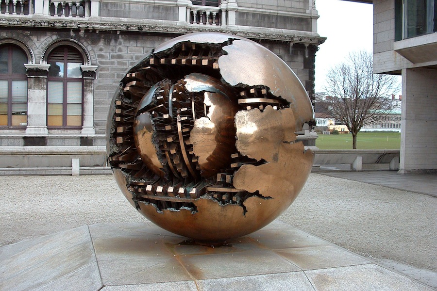 Photo of the Pomodoro sculpture outside the Berkeley Library in Trinity College Dublin.
